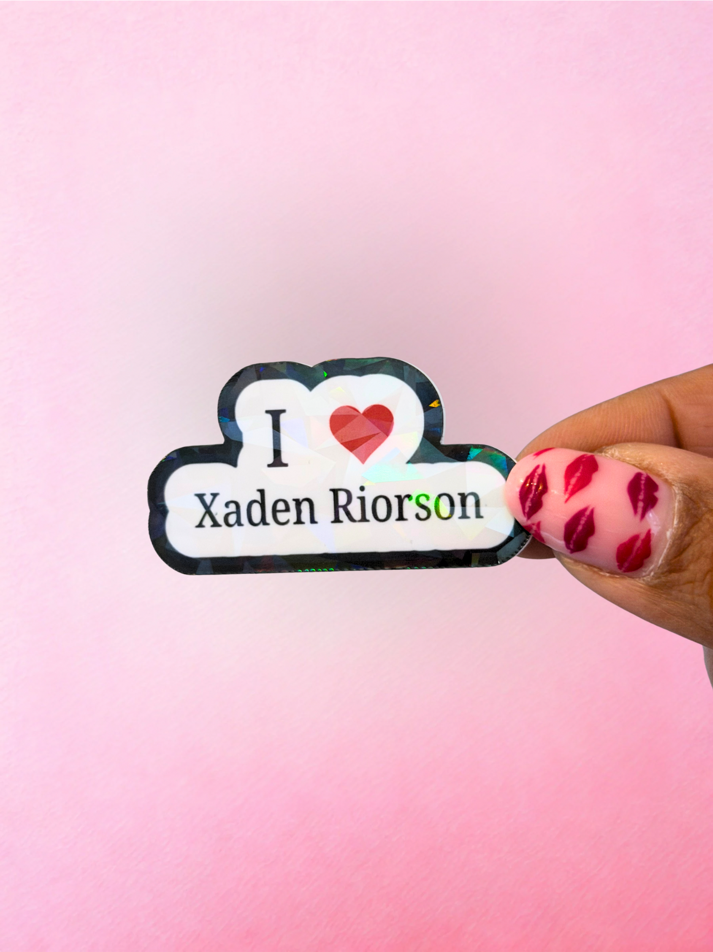 Black and white holographic style vinyl sticker with heart and Xaden Riorson text
