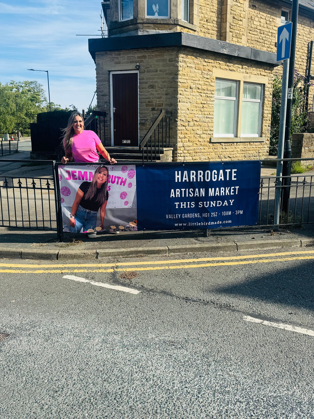 Jemmaruth designs owner stood by her picture on the little bird made, Harrogate Artisan Market Banner