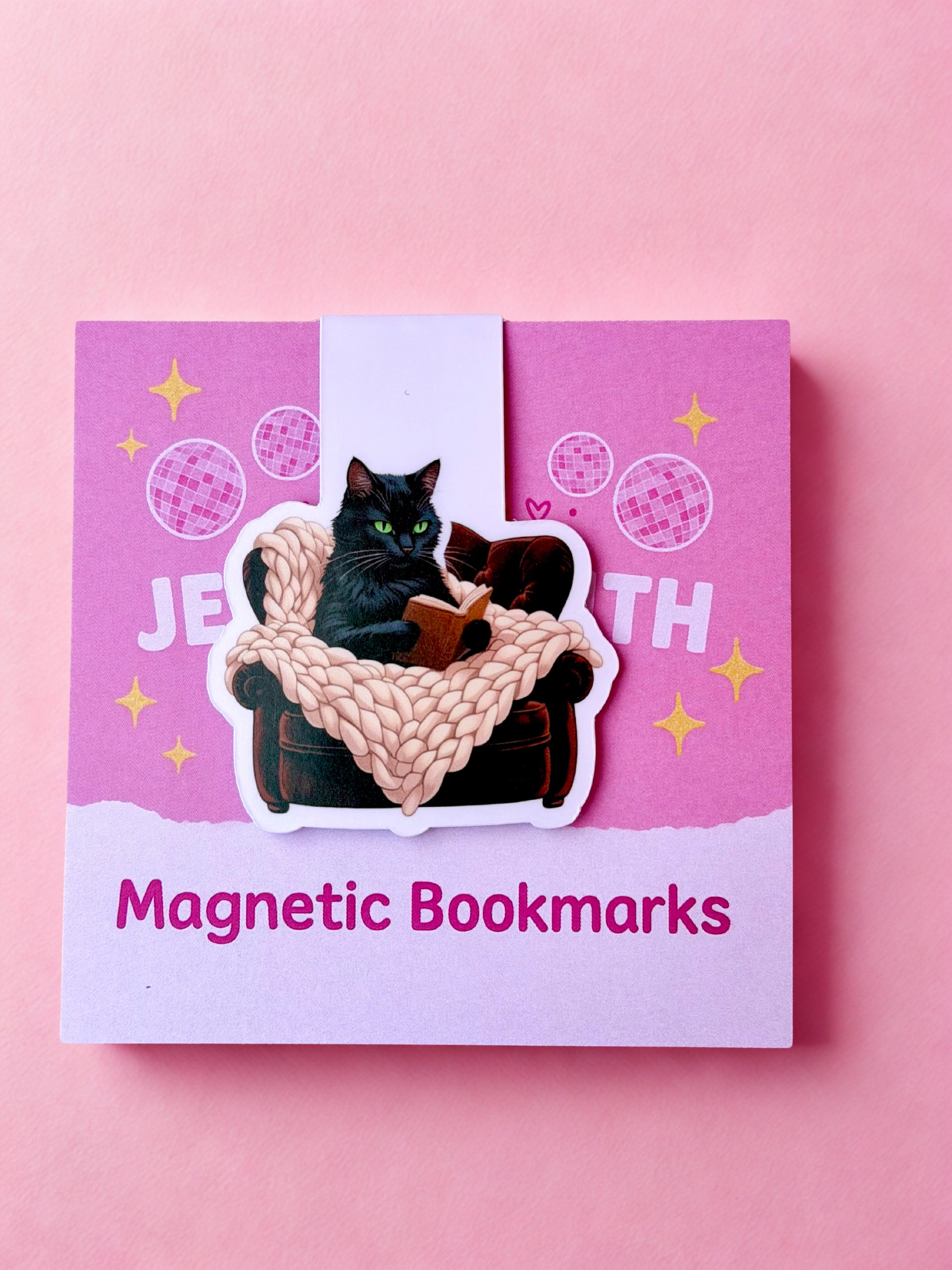 Black cat magnetic bookmark with cozy reading chair design for book lovers