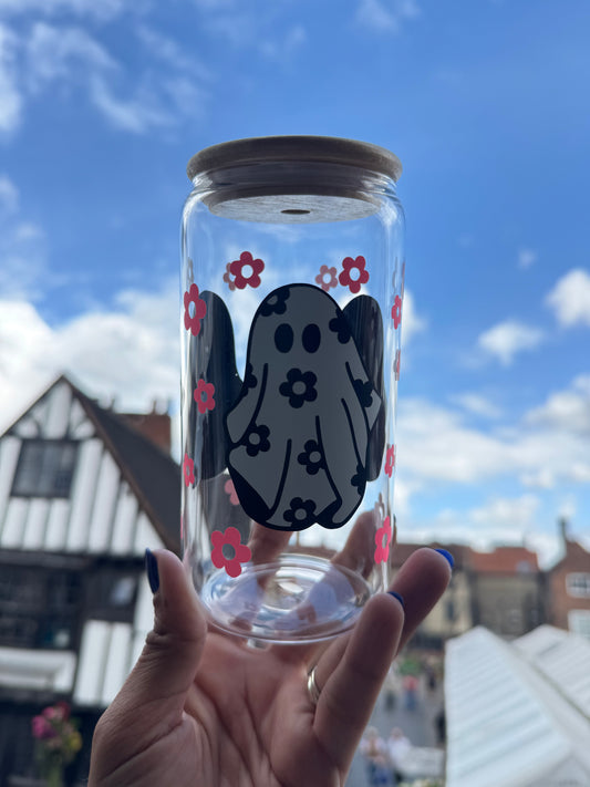 A Glass Can Cup with glow in the dark pink flower detail and boo ghost with black floral detail