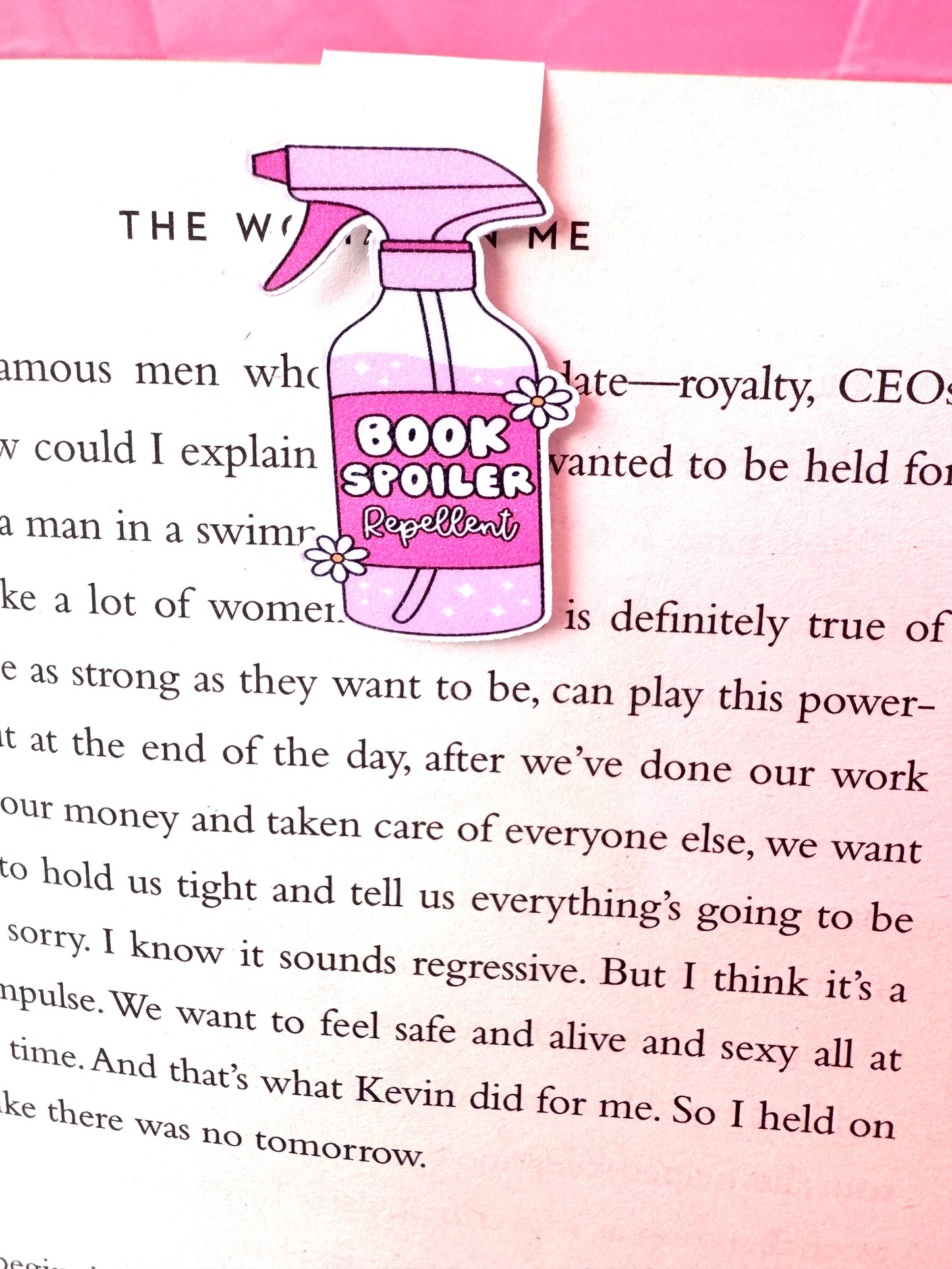 Book spoiler repellent magnetic bookmark on open book page