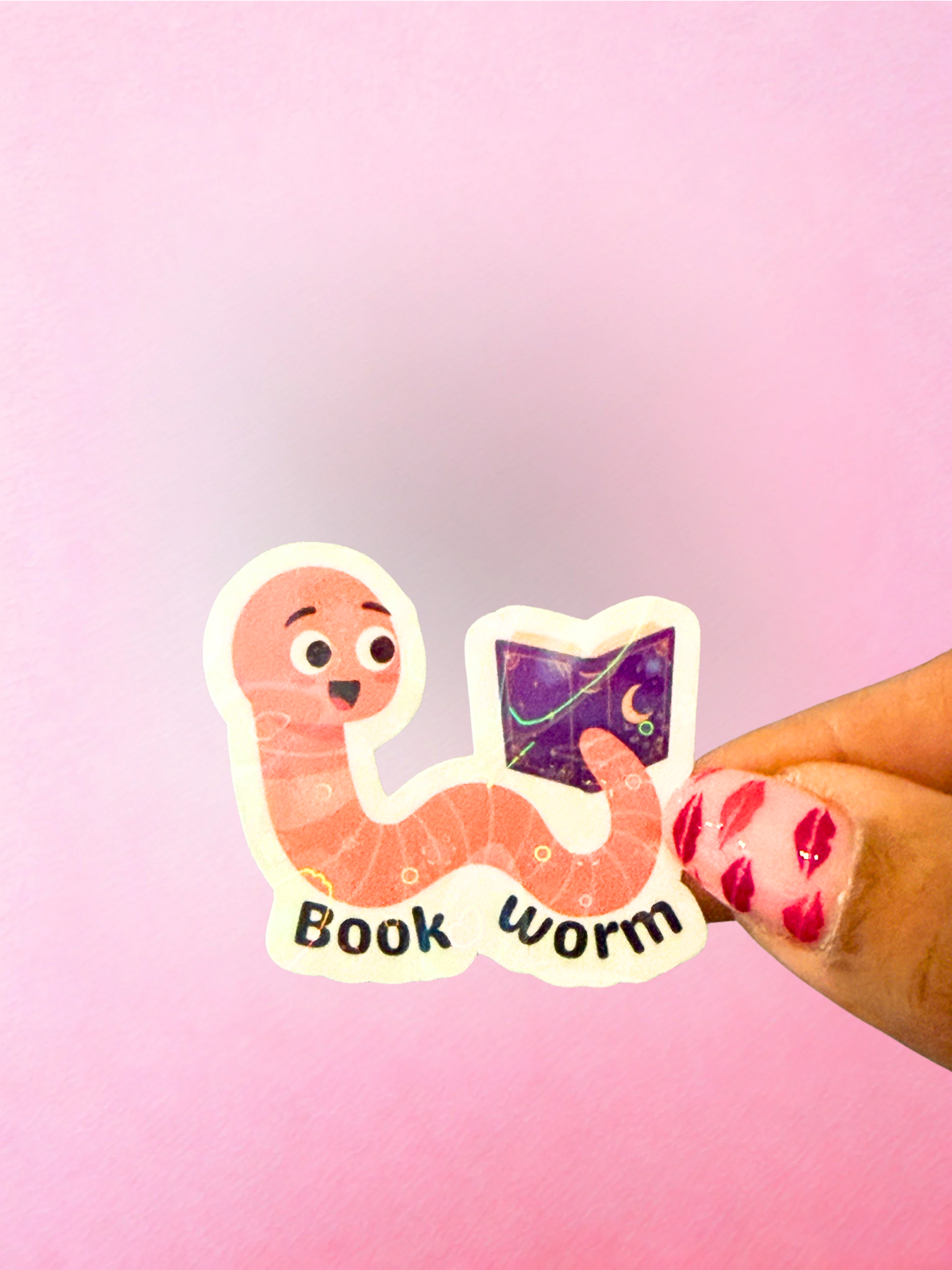 Cute book worm vinyl sticker with reading worm character holding a fantasy book