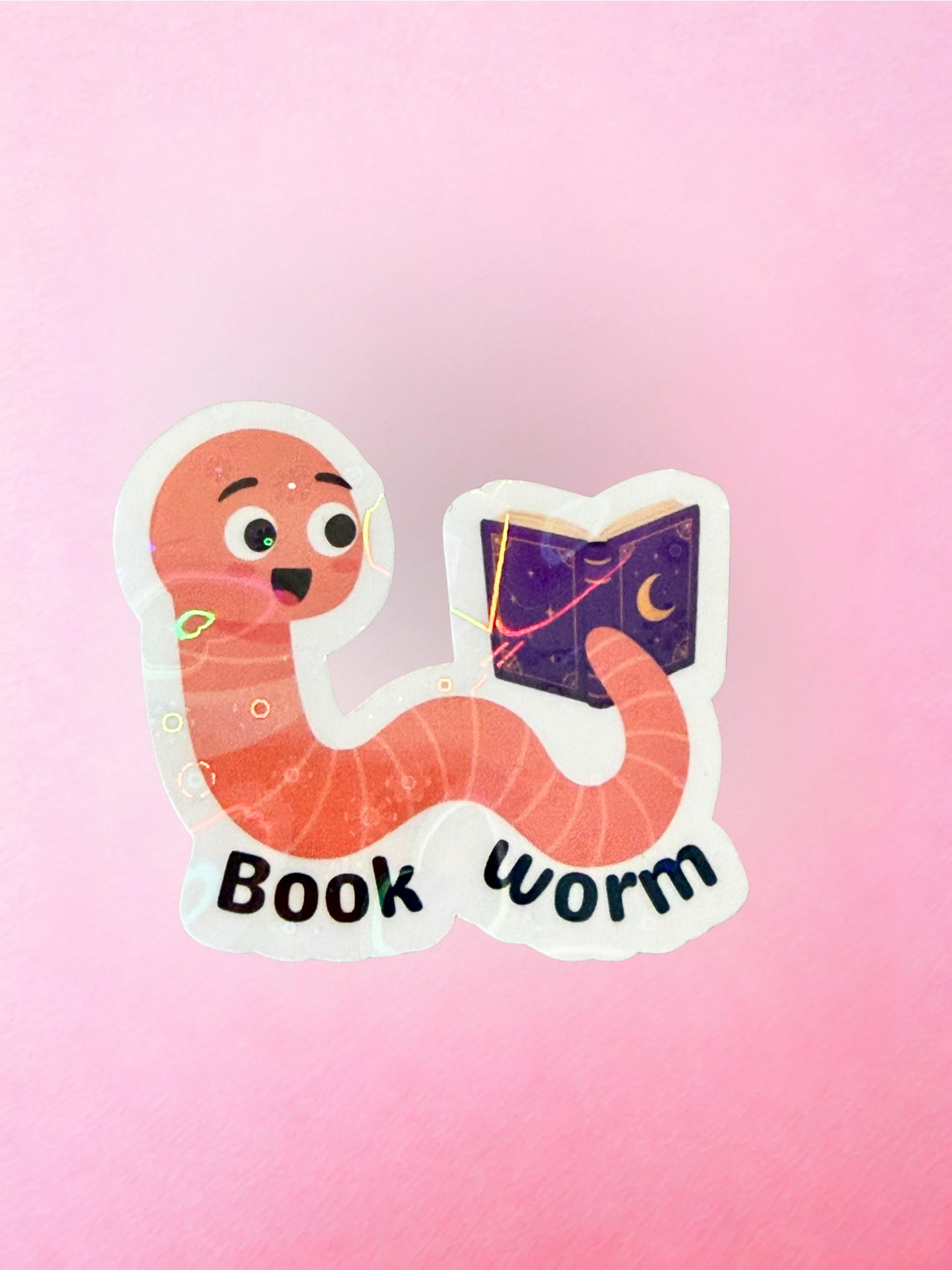 Cute book worm vinyl sticker with reading worm character holding a purple book