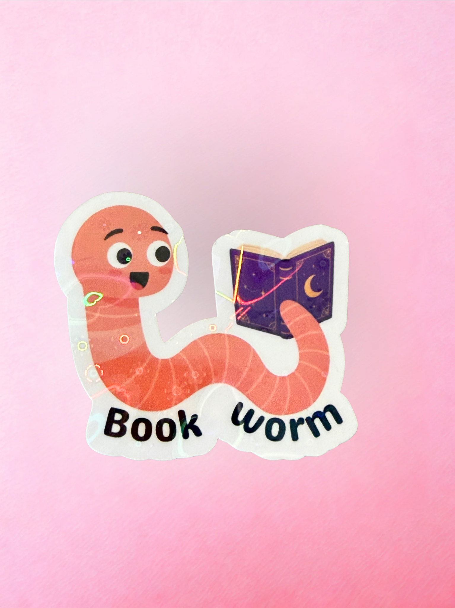 Cute book worm vinyl sticker with reading worm character holding a purple book