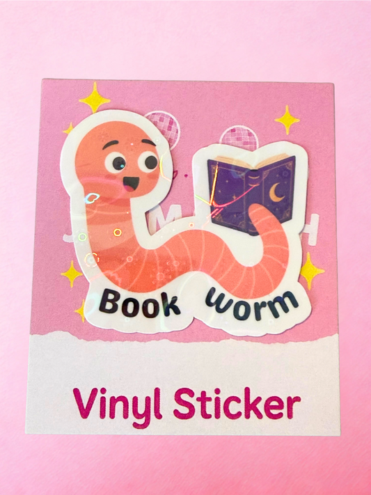 Cute book worm vinyl sticker with reading worm character holding a purple fantasy book