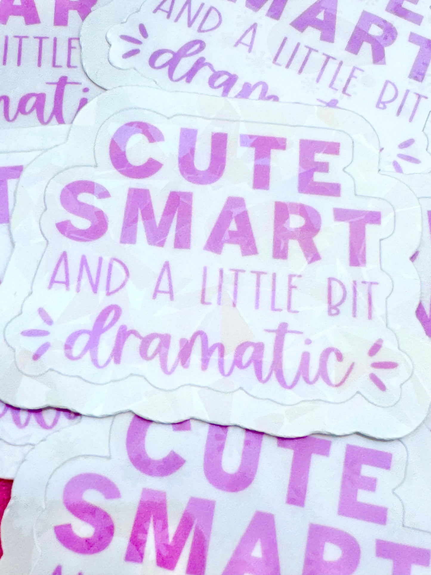 Stickers with 'Cute, Smart and a Little Bit Dramatic' text on a white background