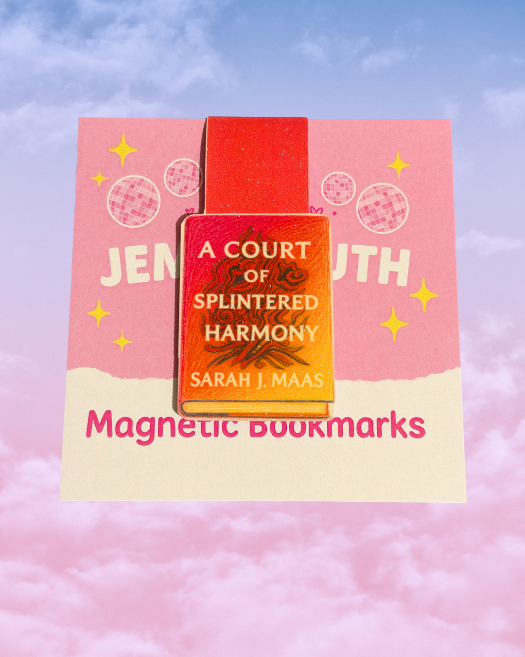 Magnetic bookmark featuring a colourful pink and orange fantasy-inspired book design displayed on JemmaRuth Designs pink packaging.