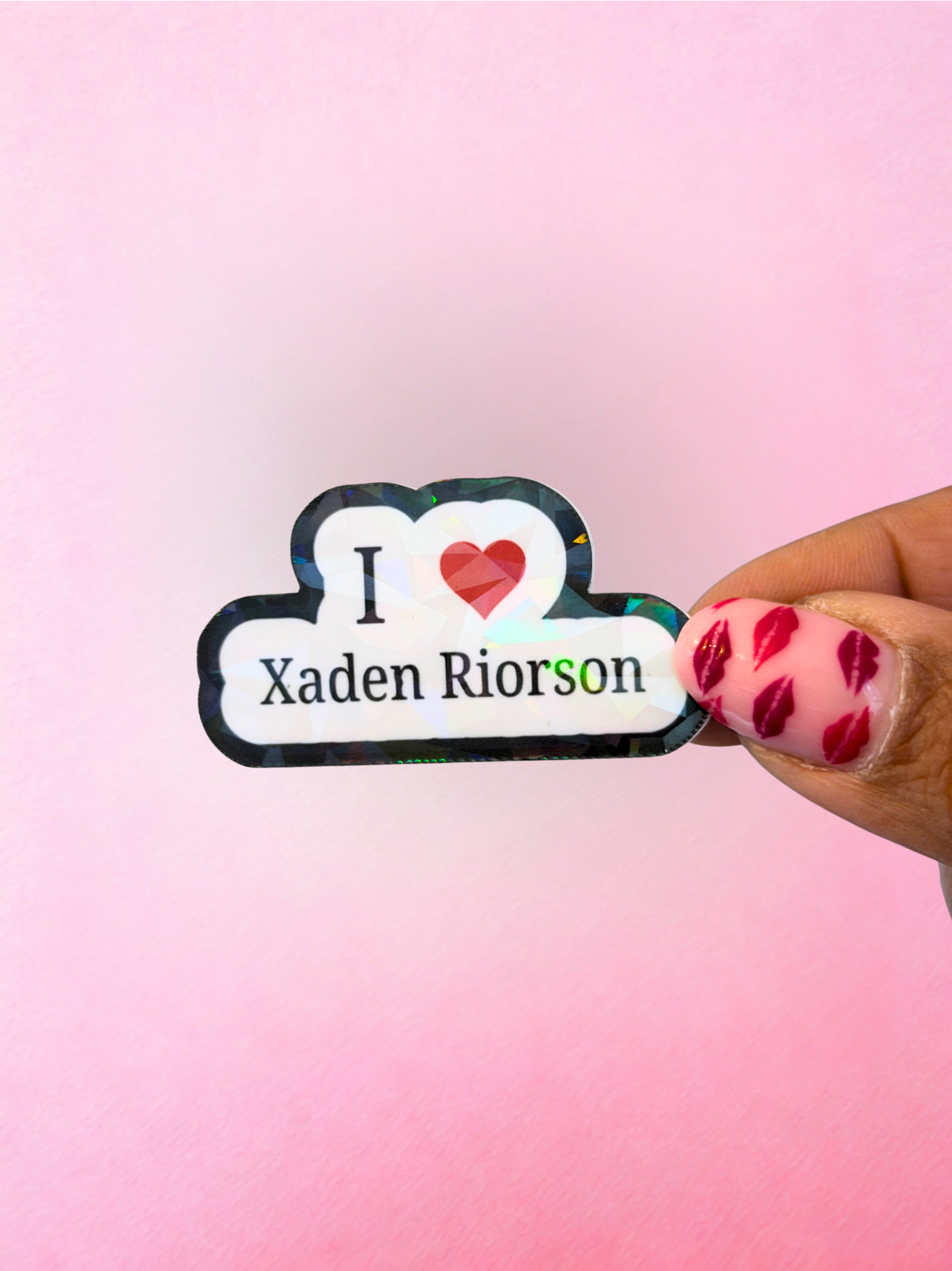 Black and white holographic style vinyl sticker with heart and Xaden Riorson text