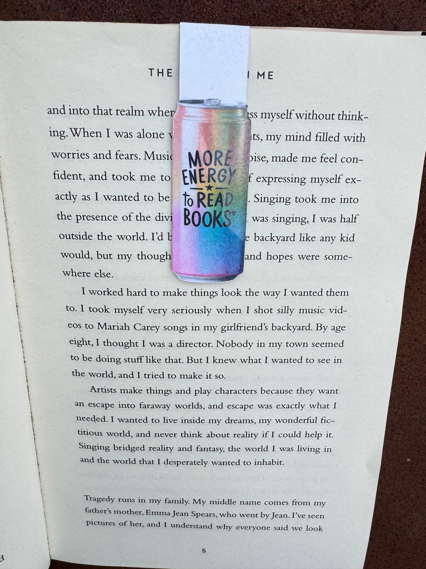 energy drink style can magnetic bookmark with rainbow colours black font saying more energy to read books magnetised to a book