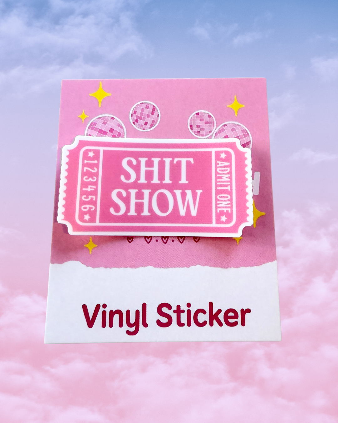 Pink ticket sticker with the words sh*t show written in white 
