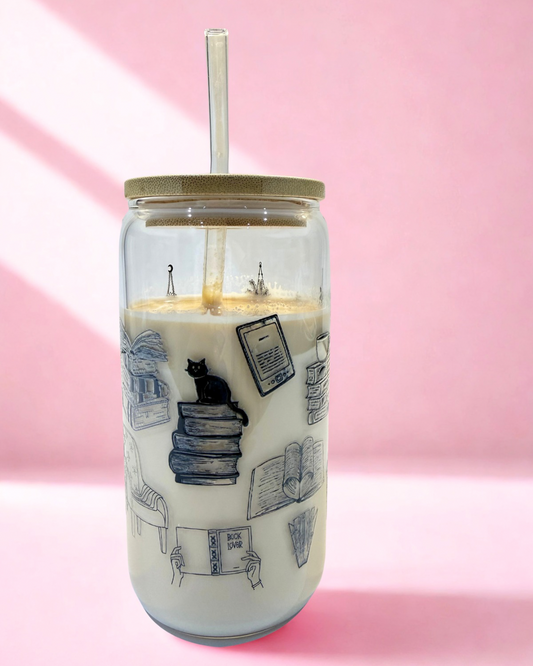 Cosy Reader 16oz bookish glass can cup with hand-drawn bookshelf, books, headphones and reading chair design